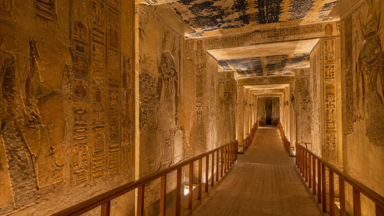 Editorial illustration: A painted ancient Egyptian tomb corridor inspired by the Valley of the Kings